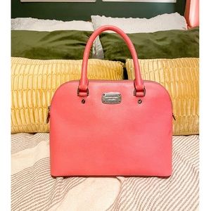 Pink Michael Kors leather purse.